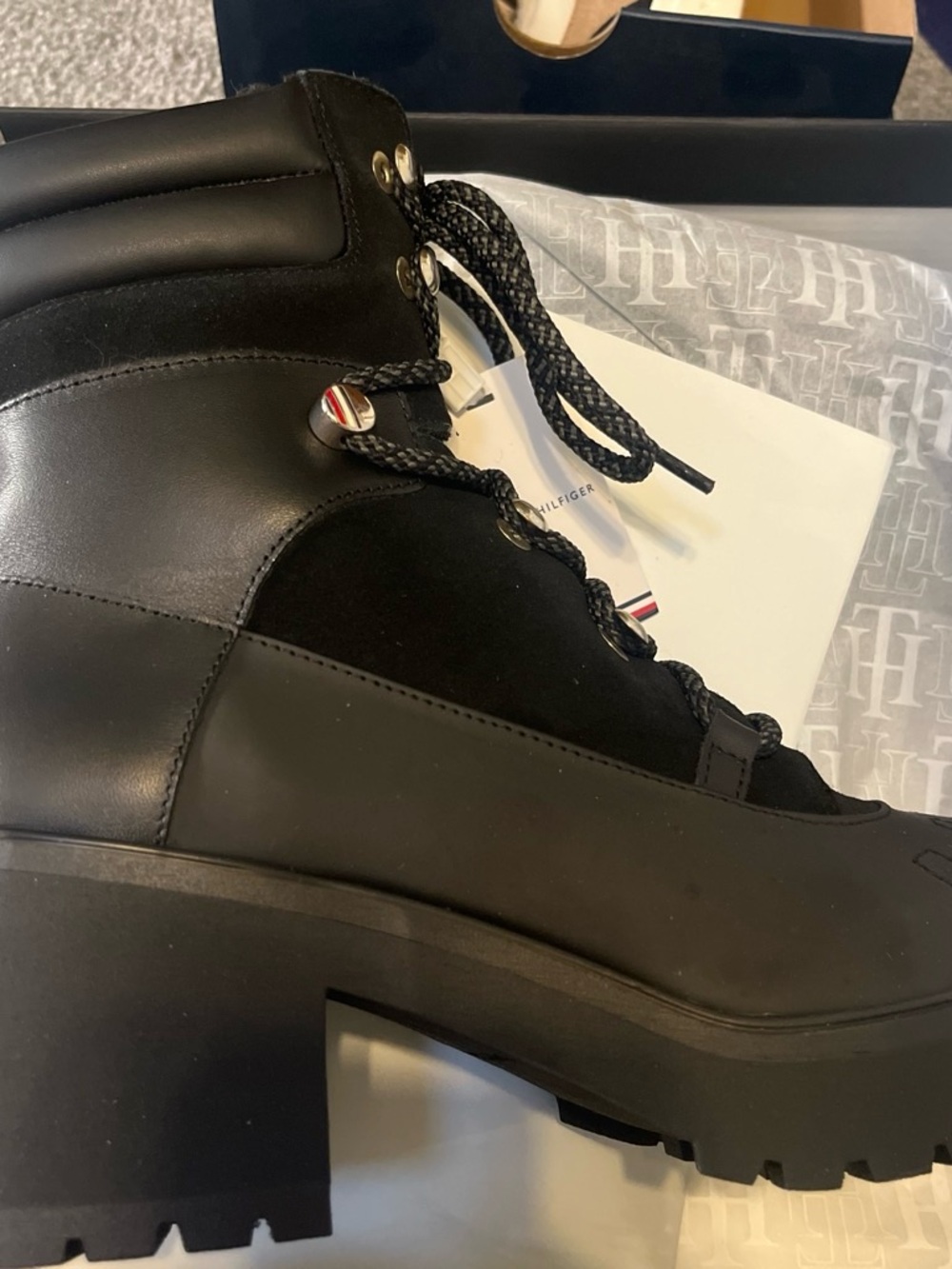 The Tommy Hilfiger Women’s “Heel Laced Outdoor Boot" (Model FW0FW06804